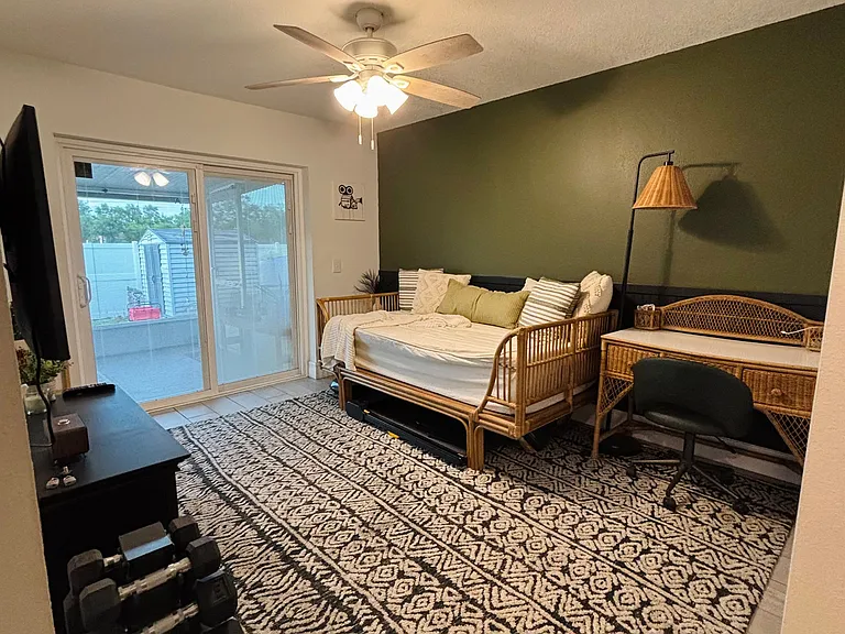 Large room with access to the backyard.