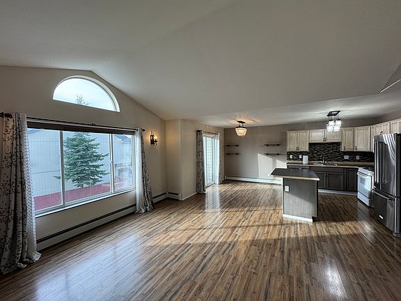 Large windows in living room. Luxury vinyl flooring.