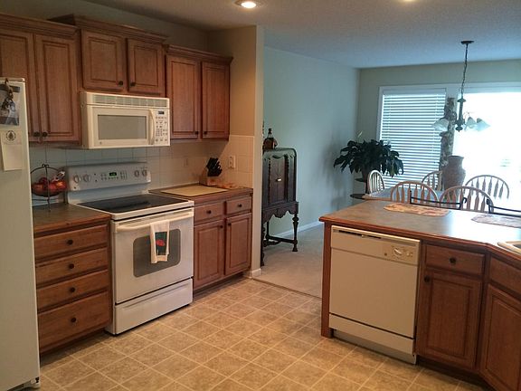 Kitchen overlooks dining and sun!