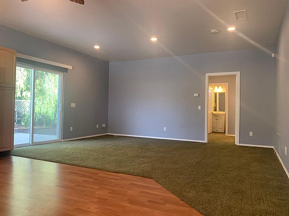 Living room area with sliding glass door out to the patio