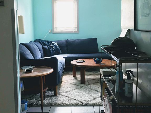 Unit has tile flooring throughout, and carpeting in the bedroom.