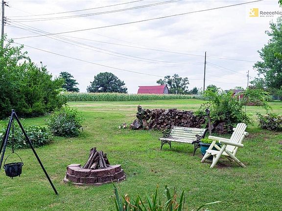Beautiful yard backs up to peaceful green space. Enjoy and evening with smores and a fire pit!