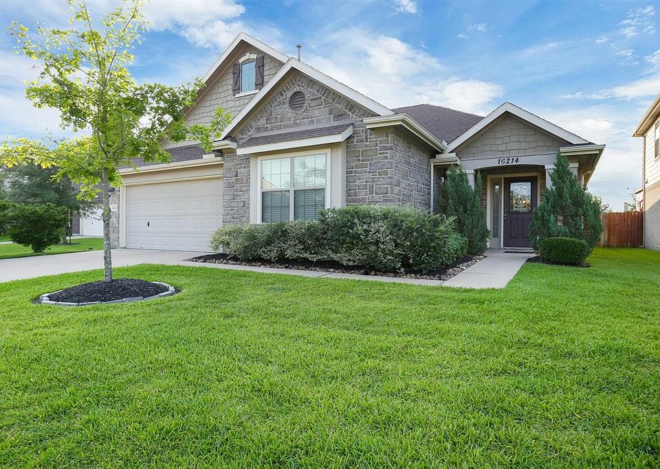 16214 Range Valley . Nice stone facade and covered entry.