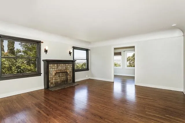LR fireplace w/sunroom to right