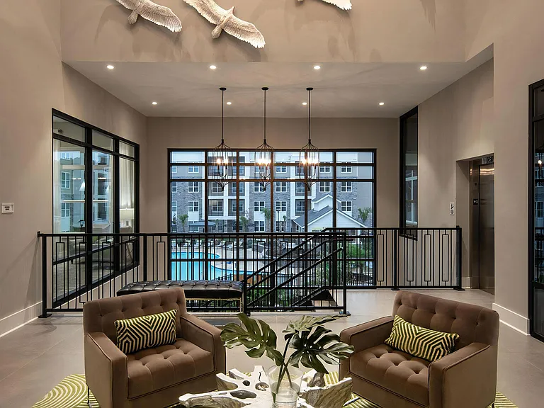 Luxe Clubhouse Lounge with Pool Views Through Floor-to-Ceiling Windows