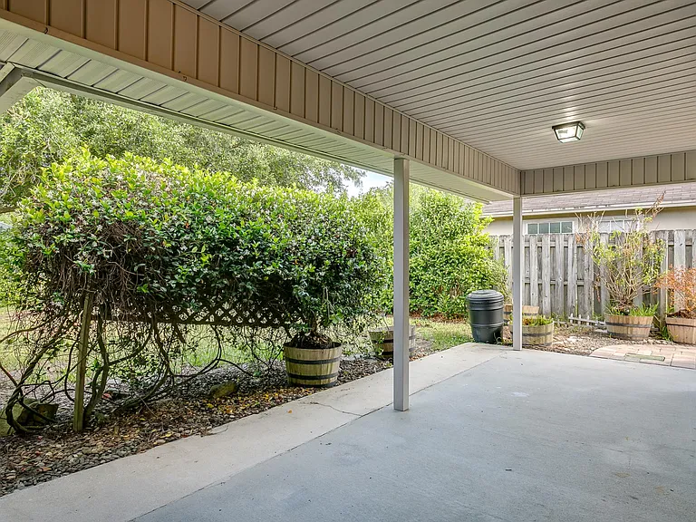Private Covered Lanai and walkway to front.
