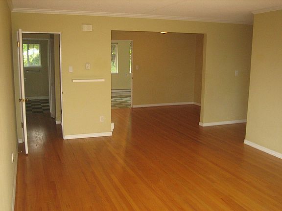 Living room facing dining room/kitchen facing north