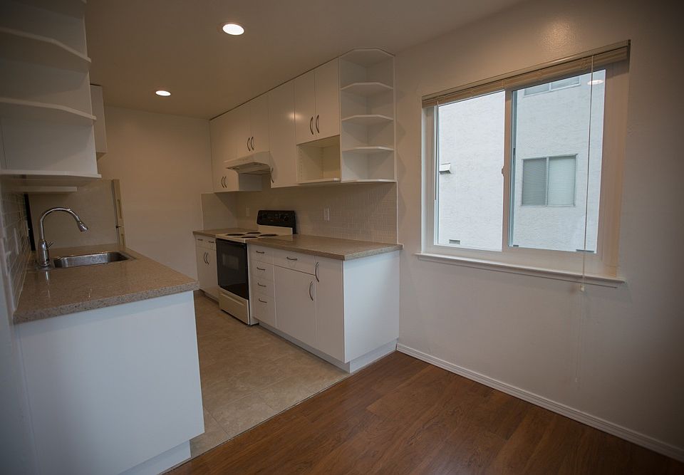 re-designed kitchen offers 16 cabinets for storage and ample