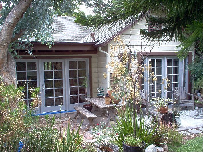 Rear of home.  Sunporch and master patio