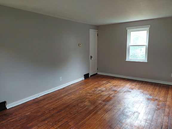 Living room view facing coat closet