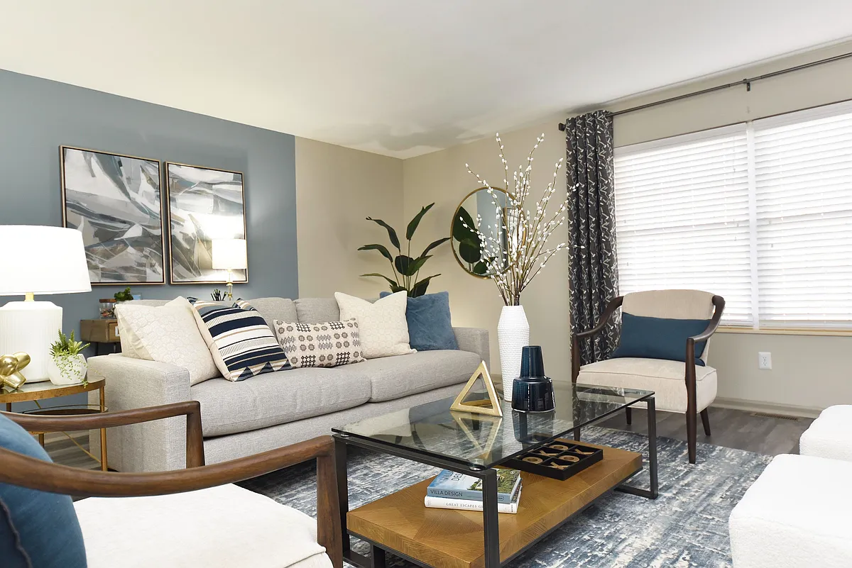 Experience tranquility in this elegantly designed living room, perfect for relaxation and entertaining. - Everly at Meridian Hills