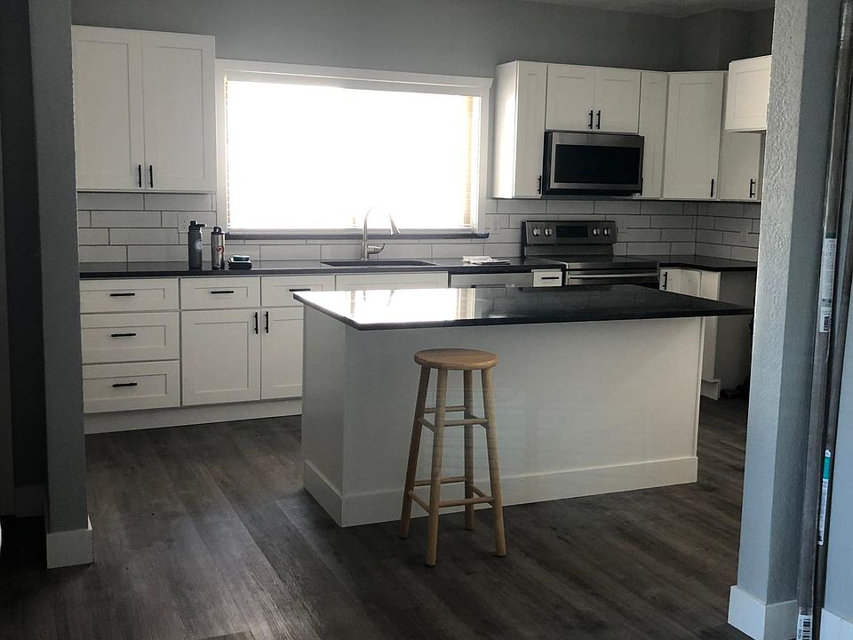 Brand new kitchen with white cabinets with soft close cupboards and drawers with Island and granite counter tops