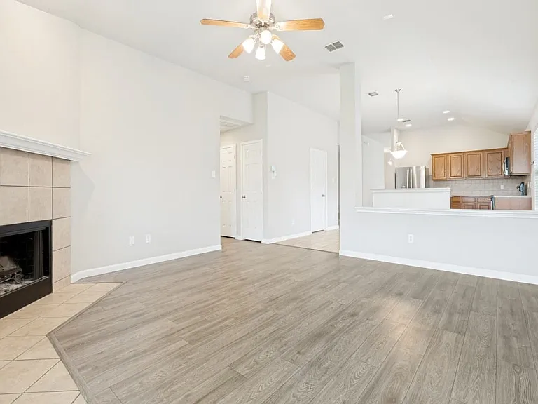 Open plan living room flowing to the kitchen area