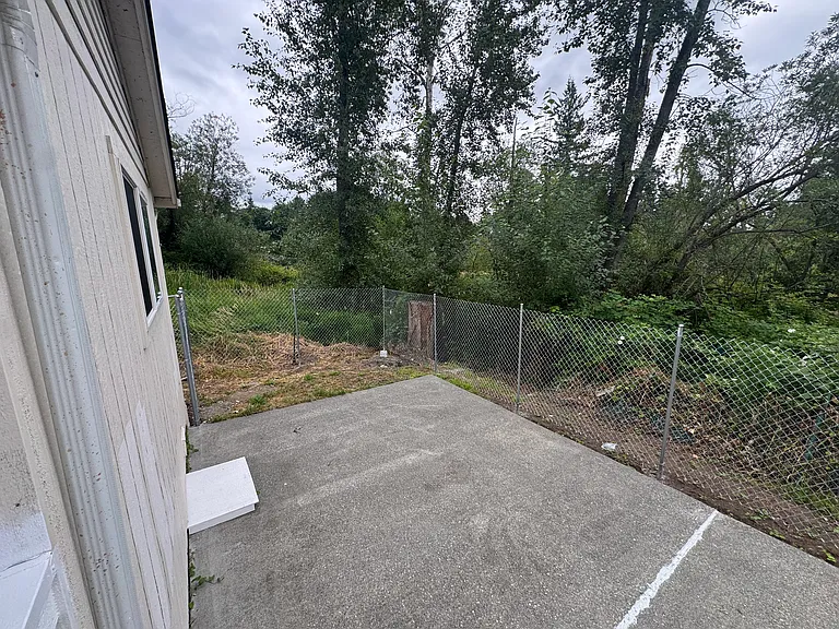 Enjoy a private fenced backyard that backs directly onto Jennings Park, creating a quiet and scenic outdoor setting.