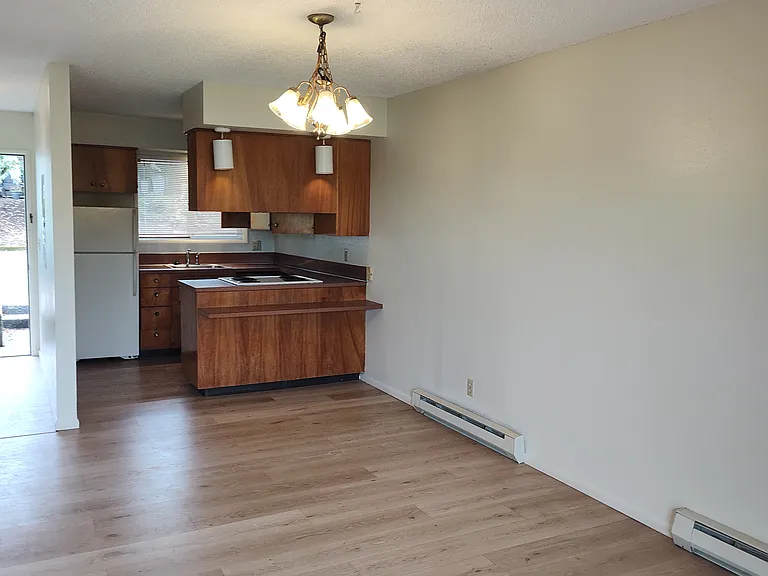 Dining area toward kitchen with an eat at counter