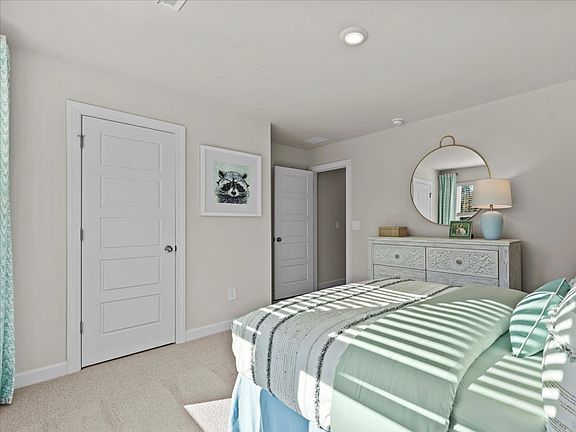 Secondary bedroom in the Brentwood floorplan at a Meritage Homes community in Greenville, SC.