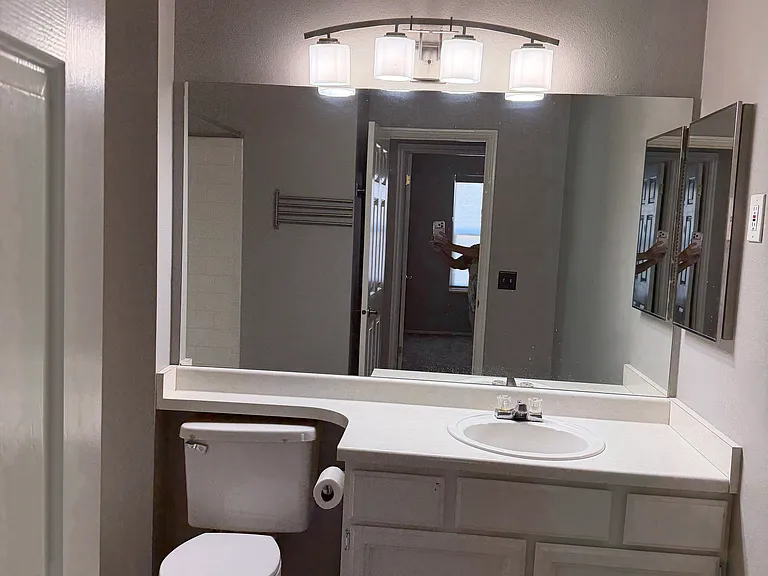 Upstairs full bathroom, shower/tub combination, new paint.