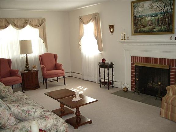 Brightly lit living room with fireplace