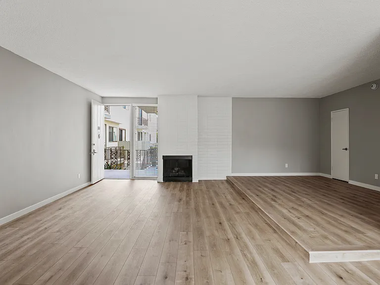 Large-Size Living Room with Electric Fireplace, Vinyl Flooring, and Patio