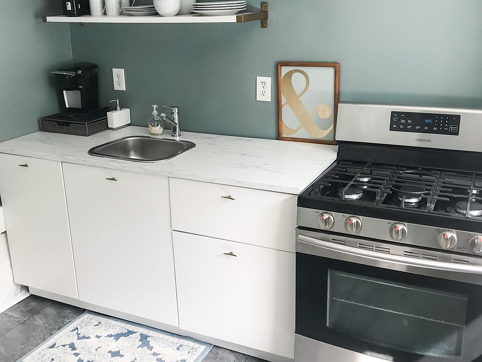 Brand new kitchen with upgraded appliances, including gas range.