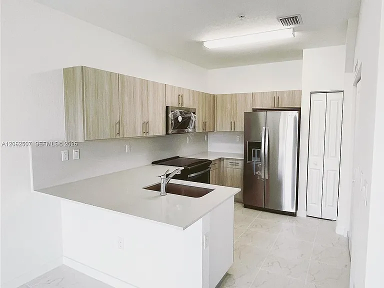 15560 SW 136th St #207 — Photo 11