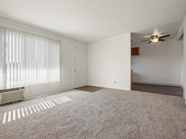 Living room with carpeted flooring, air conditioning