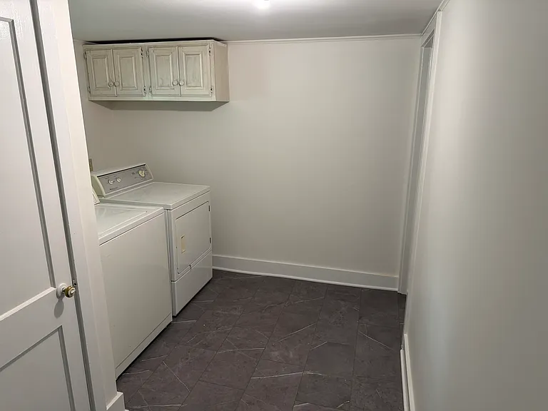 Laundry area from hallway. Door to primary bedroom is on the right
