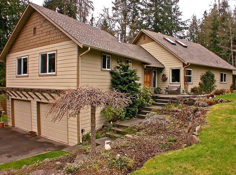 This unique Edmonds home is located on a dead-end street, at the end of a long private driveway. The