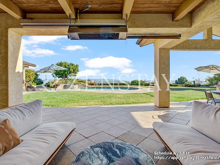 Outdoor seating area ideal for relaxing, dining, and entertaining year-round