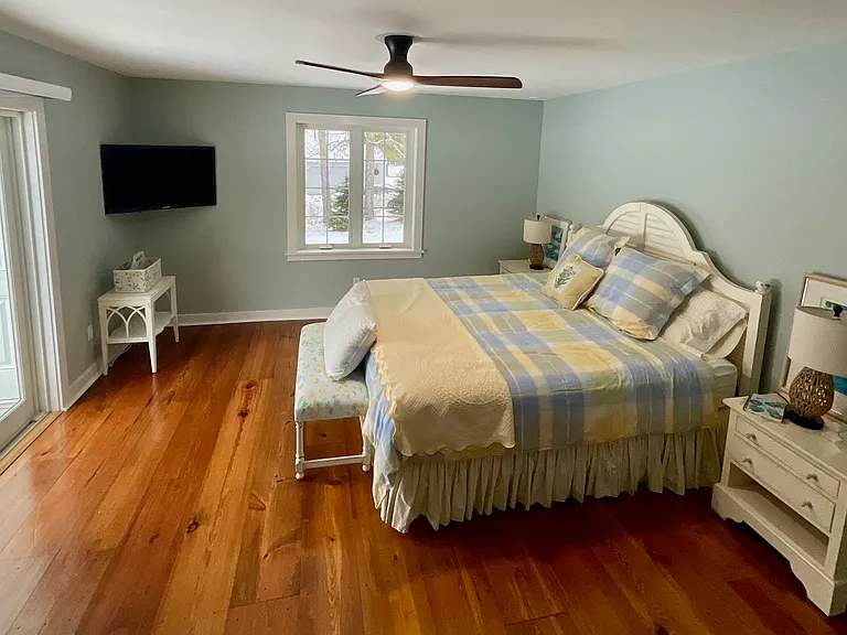 First floor primary suite with access to patio