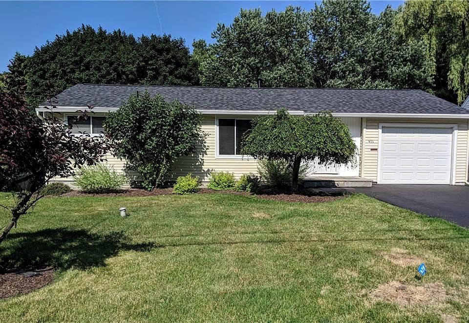 Welcome to 411 Skyview Terrace. Check out that new roof! As you approach the front door, you see a beautiful bluestone landing and mature landscape.