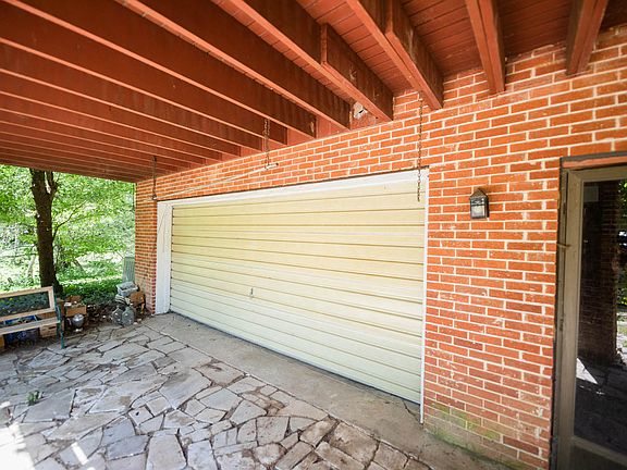 covered garage entry and work area