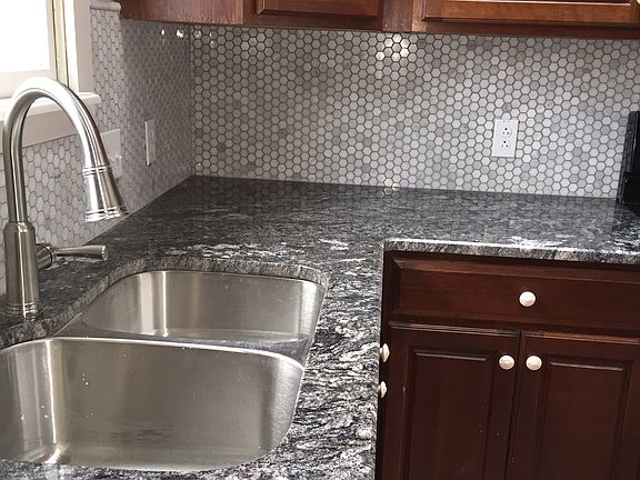 New Stnls sink & granite/tile