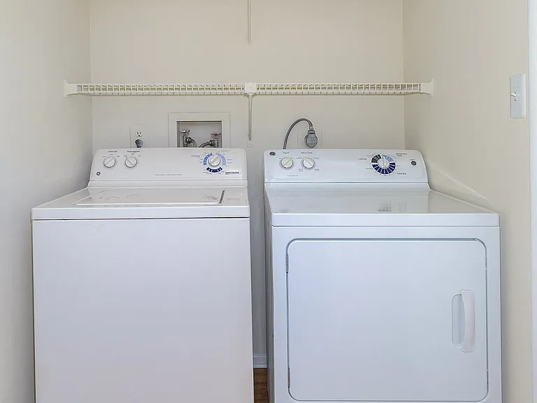 In-unit laundry with built-in shelves
