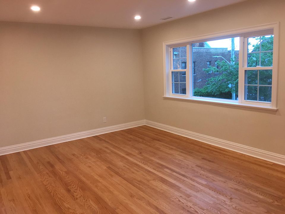 Large Living room with new Hardwood Floors & Picture window 