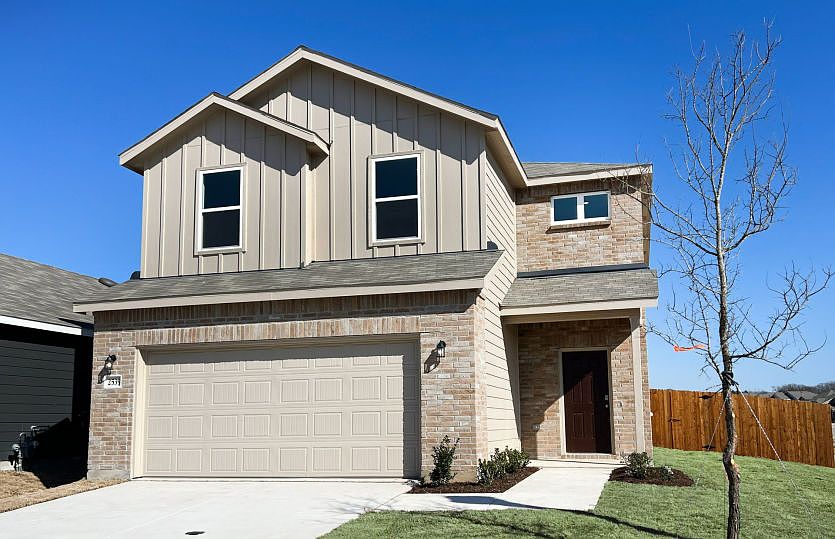 The Frio, a two-story home with 2-car garage, home exterior LS103 exterior features may differ