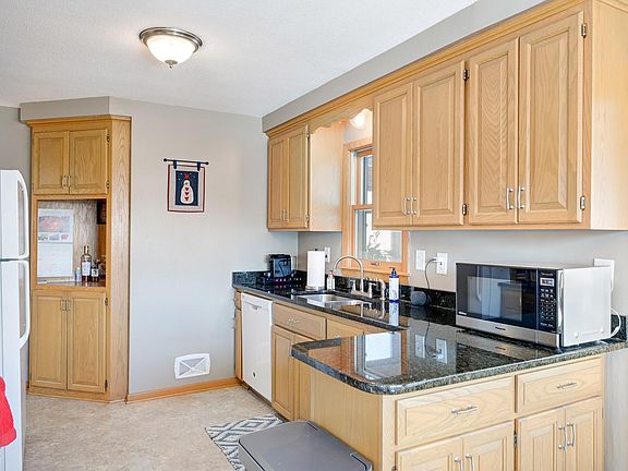 Kitchen has granite counters, dishwasher, and tons of cabinet space.