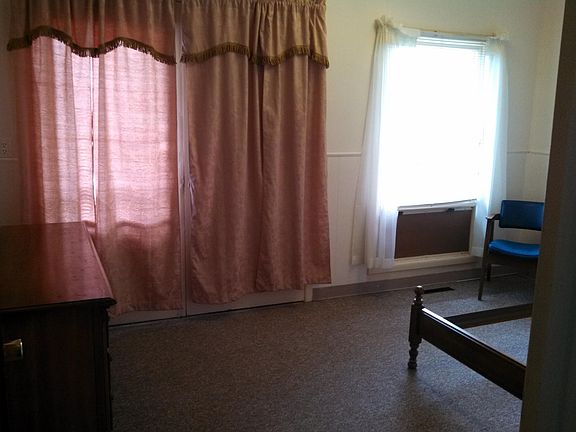 This room has french doors behind drapes at grade level. cou