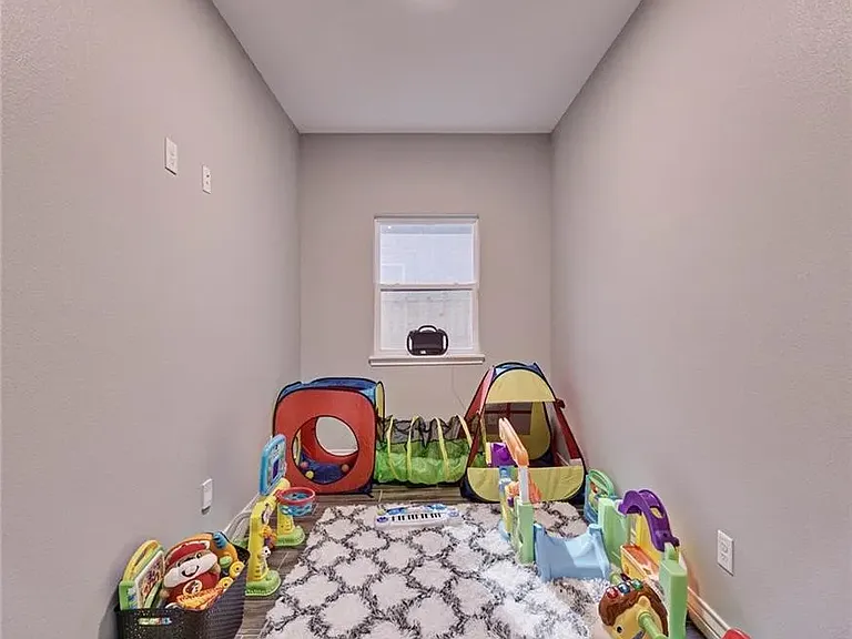 Versatile space ideal for a play area, home office, or additional living space.