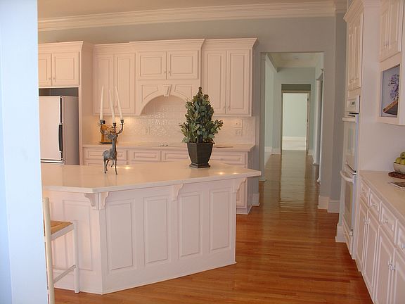 Kitchen approached from hallway to oversized garage.