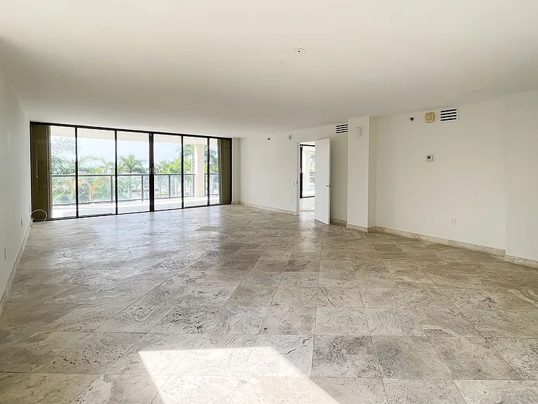 Classic travertine floors throughout and clean lines create a seamless space ideal to tailor with personal interior design choices