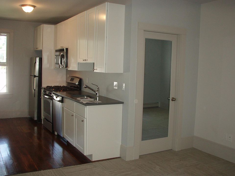 Kitchen with Stainless appliances, granite counters, disposal and dishwasher.