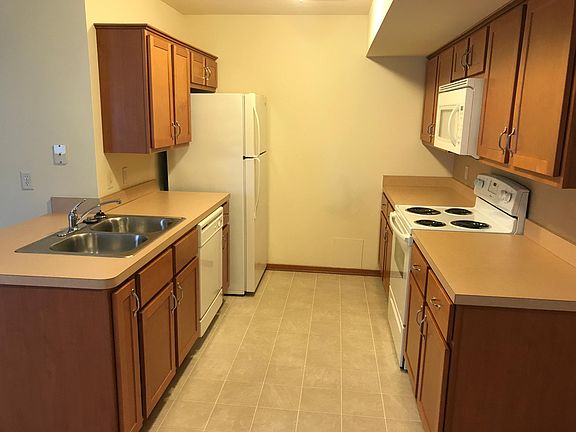 Kitchen includes oven/range, mocrowave, dishwasher, freezer/fridge & two compartment sink w disposal