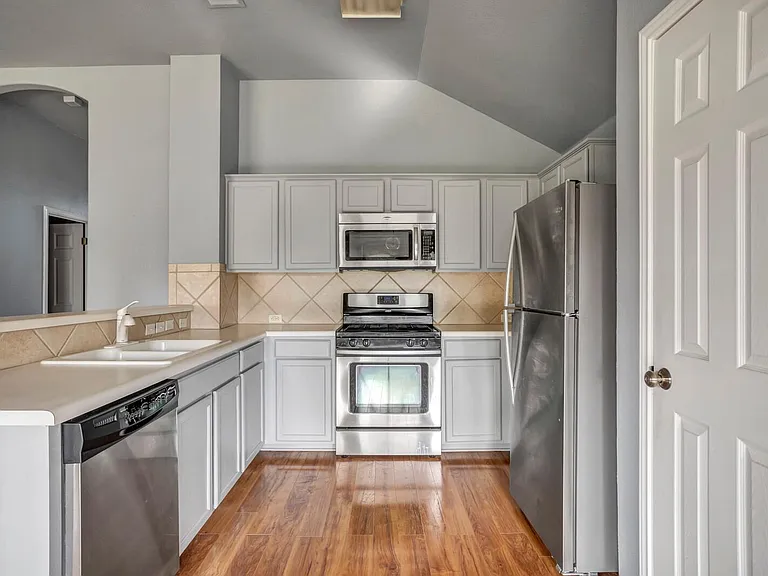 Kitchen with all stainless steel appliances.