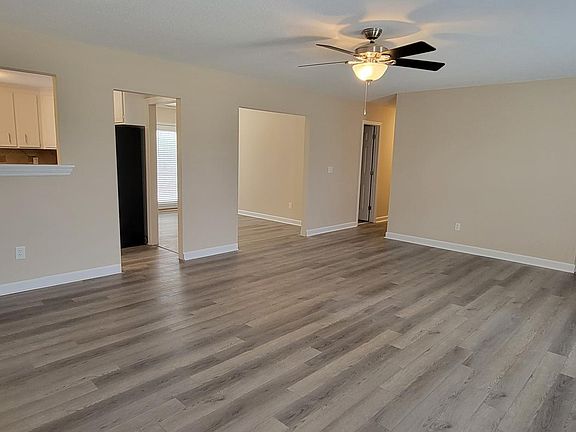 Family room with entrances to kitchen and dining.