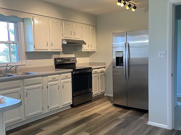 Renovated kitchen with new appliances.