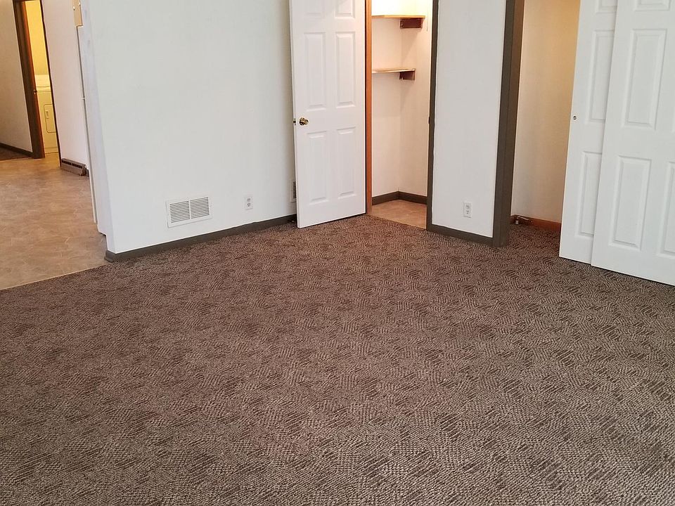 Spacious living room with plenty of natural light & nuetral