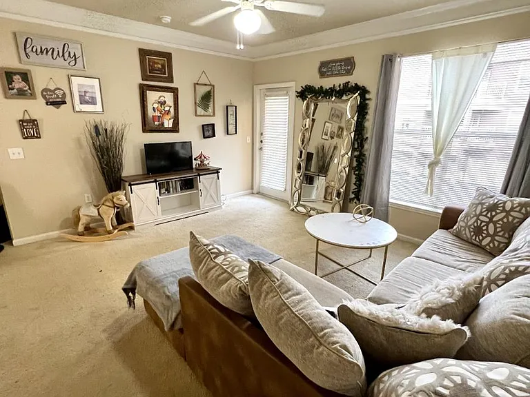 Living room as furnished by a prior tenant