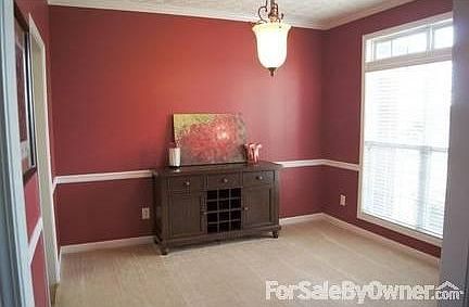 Formal Dining Room/Den
						:
						Off the kitchen and foyer. Vaulted Ceiling with crown molding and chair rail.