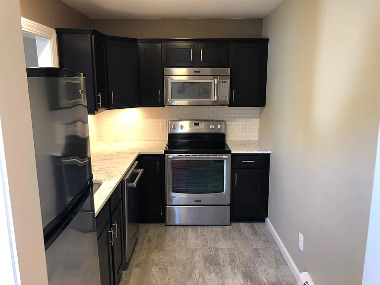Galley kitchen with stainless steel appliances